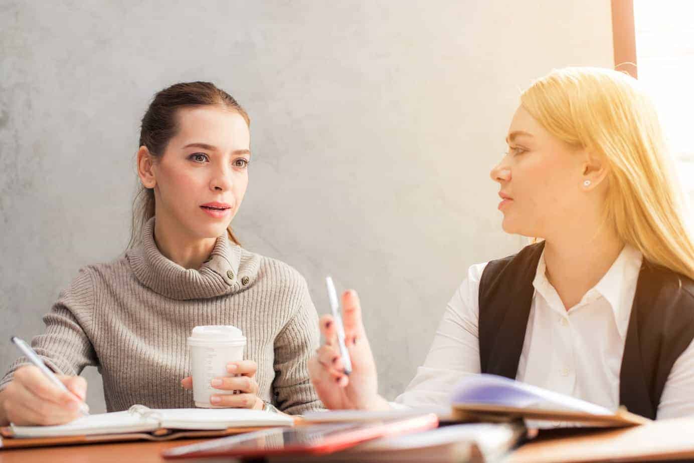 Two Women Talking Two women conversing at a table