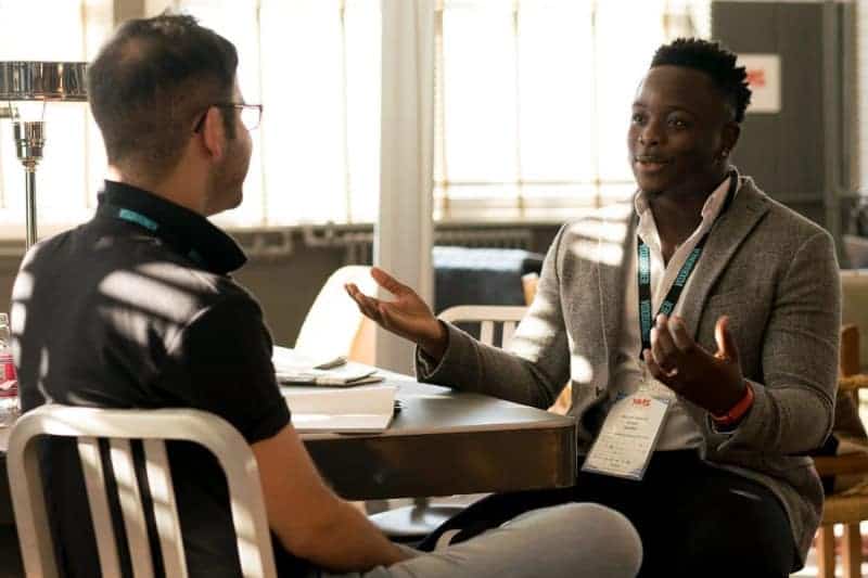 Businessmen Chatting Two men at a table explaining business