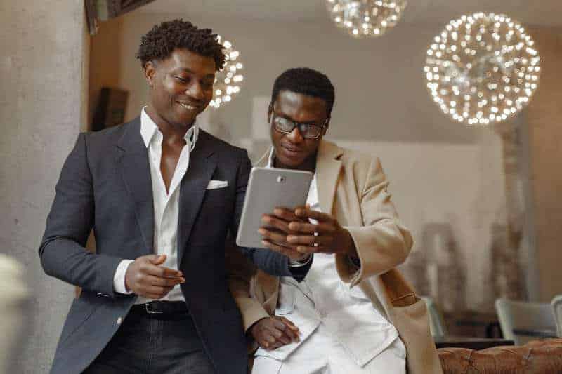 VSA, Inc – Business Networking Two businessmen chatting about the contents of a tablet
