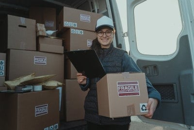 Professional mail lady delivering sensitive packages