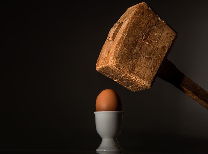 Hammer about to crack open an egg