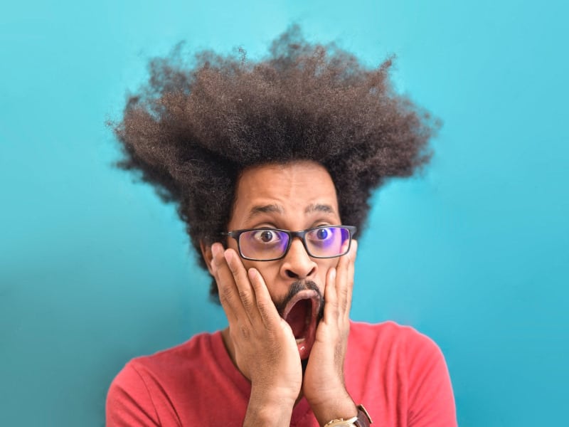 Shocked Black man with his hair poofed up