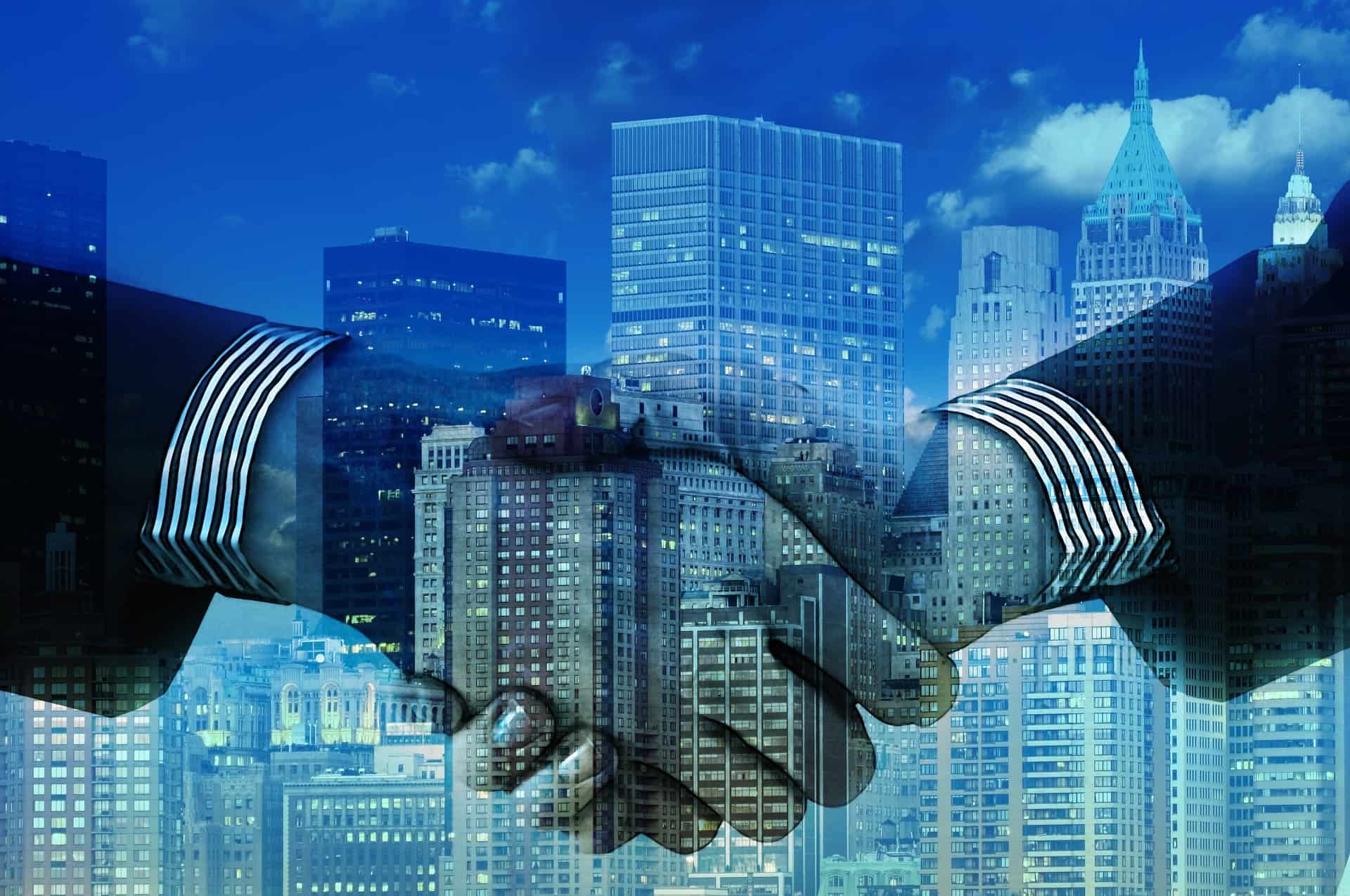 Business Handshake with cityscape in the background